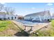 Spacious backyard featuring a pool covered for the off-season, patio, and manicured landscaping at 139 W Jefferson St, Jamestown, IN 46147