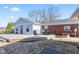 Backyard featuring an outdoor dining area, brickwork, and a fire pit, perfect for entertaining at 139 W Jefferson St, Jamestown, IN 46147