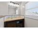 Modern bathroom with a glass bowl sink, custom wood vanity, and natural light from the window at 139 W Jefferson St, Jamestown, IN 46147