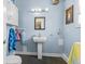 Cozy bathroom with a pedestal sink, cute decor, and soft lighting at 139 W Jefferson St, Jamestown, IN 46147