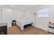 Bedroom with a bed, a nightstand, and a window letting in natural light at 139 W Jefferson St, Jamestown, IN 46147