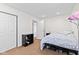 Bedroom with an open closet, a doorway and a bed with storage underneath at 139 W Jefferson St, Jamestown, IN 46147