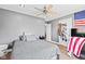 Bright bedroom with a ceiling fan, a closet, and a bed with soft pillows and linens at 139 W Jefferson St, Jamestown, IN 46147