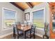 Charming dining area with a square table set for four, bright natural light, and a cabinet at 139 W Jefferson St, Jamestown, IN 46147