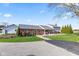 Well-maintained home with a large yard, a detached garage, and a paved driveway at 139 W Jefferson St, Jamestown, IN 46147