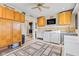 Well-appointed laundry room with a full washer and dryer set, plenty of counter space, and ample storage cabinets at 139 W Jefferson St, Jamestown, IN 46147