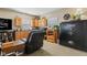 Relaxing living room area with wood cabinets, a black leather recliner and a Cannon safe for secure storage at 139 W Jefferson St, Jamestown, IN 46147