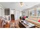 Spacious living room with hardwood floors and ample natural light, perfect for relaxing or entertaining at 139 W Jefferson St, Jamestown, IN 46147
