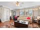 Comfortable living room with hardwood floors, neutral tones, and ample natural light at 139 W Jefferson St, Jamestown, IN 46147