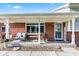 Inviting covered porch with seating area, ideal for enjoying the outdoors at 139 W Jefferson St, Jamestown, IN 46147