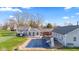 Aerial view showcasing the home's pool, outdoor deck, and spacious backyard at 139 W Jefferson St, Jamestown, IN 46147