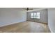 Bright bedroom with hardwood floors, ceiling fan, and large window allowing natural light at 14402 Allison Dr, Carmel, IN 46033