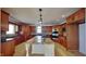 Well-appointed kitchen with wood cabinets, granite countertops, and a spacious center island at 14402 Allison Dr, Carmel, IN 46033