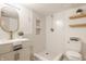 Modern bathroom with walk-in shower, stylish vanity with sink, floating shelves, and modern fixtures at 1448 Sedona Dr, Carmel, IN 46032