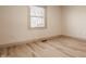 Bedroom featuring a bright window letting in natural light and light colored hardwood flooring at 1448 Sedona Dr, Carmel, IN 46032