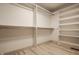 Bright, well-organized walk-in closet with custom shelving and hanging rods for ample storage at 1448 Sedona Dr, Carmel, IN 46032