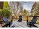 An outdoor deck featuring black patio furniture, natural view, and outdoor rug at 1448 Sedona Dr, Carmel, IN 46032