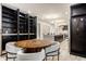 Contemporary dining area showcases a spacious layout, seamlessly connected to the modern kitchen, with built-in storage at 1448 Sedona Dr, Carmel, IN 46032