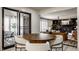 Bright dining area leads to outdoor patio and living room, creating a cohesive and inviting living space at 1448 Sedona Dr, Carmel, IN 46032