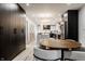 Open floor plan combines modern kitchen and dining areas, enhanced by light wood floors and stylish pendant lighting at 1448 Sedona Dr, Carmel, IN 46032
