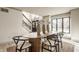 Bright dining area with wood table, stylish chairs, and natural light at 1448 Sedona Dr, Carmel, IN 46032