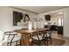 Dining room with a wood table, seating for six, and modern decor at 1448 Sedona Dr, Carmel, IN 46032