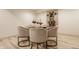 Dining area features glass table, seating for four, stylish decor, and bright interior at 1448 Sedona Dr, Carmel, IN 46032