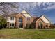 Stunning two-story brick home featuring a meticulously landscaped front yard and grand entrance at 1448 Sedona Dr, Carmel, IN 46032