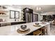 Modern kitchen featuring a large island with seating, stainless steel appliances, and an open design at 1448 Sedona Dr, Carmel, IN 46032