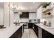 Bright kitchen features marble countertops, stainless steel appliances, pendant lighting, and light wood flooring at 1448 Sedona Dr, Carmel, IN 46032