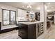 Modern kitchen featuring a central island with a wine fridge, sleek cabinets and stainless steel appliances at 1448 Sedona Dr, Carmel, IN 46032