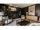 Spacious living room featuring dark accent wall, fireplace, and stylish decor at 1448 Sedona Dr, Carmel, IN 46032