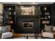 Inviting living room showcasing a black brick fireplace and built-in bookshelves at 1448 Sedona Dr, Carmel, IN 46032
