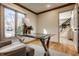 Comfortable office space with a glass desk and an accent chair at 1448 Sedona Dr, Carmel, IN 46032