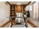 Chic office space with glass desk, shelving, and neutral color palette at 1448 Sedona Dr, Carmel, IN 46032