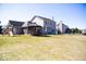 Expansive backyard featuring a wooden gazebo, play structure, screened in porch, and well-maintained lawn at 14573 Waverly Dr, Carmel, IN 46033