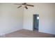 Bedroom features neutral carpet, white walls, a ceiling fan, and leads into a bathroom at 14573 Waverly Dr, Carmel, IN 46033