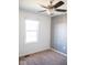 This bedroom has carpet and a window, complete with geometric wallpaper at 14573 Waverly Dr, Carmel, IN 46033