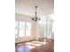 Bright living room with hardwood floors and windows providing ample natural light at 14573 Waverly Dr, Carmel, IN 46033