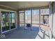 Covered porch with screened-in windows and backyard view at 14573 Waverly Dr, Carmel, IN 46033