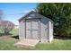 Backyard storage shed on a well-maintained lawn with a small wooden ramp at 1494 Mimosa Ct, Greenfield, IN 46140