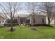 Well maintained brick home with a lush green lawn and landscape design at 15254 Kampen Cir, Carmel, IN 46033