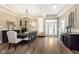 Elegant dining room features hardwood floors, stylish chandelier, and large windows at 15254 Kampen Cir, Carmel, IN 46033