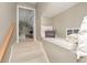 Cozy hallway with a window seat, neutral paint colors, and carpet at 15254 Kampen Cir, Carmel, IN 46033