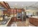 Well-appointed kitchen with granite countertops, stainless steel appliances, and open layout at 15254 Kampen Cir, Carmel, IN 46033