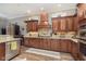 Beautiful kitchen featuring wooden cabinets, granite countertops and stainless steel appliances at 15254 Kampen Cir, Carmel, IN 46033