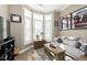 Inviting living room with natural light, comfortable seating, and sports memorabilia, perfect for relaxation and entertainment at 15254 Kampen Cir, Carmel, IN 46033