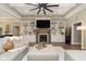 Cozy living room features a fireplace, custom built-ins, and comfortable seating at 15254 Kampen Cir, Carmel, IN 46033