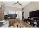 Functional home office with a desk setup, multiple monitors, and a cozy seating area for work and relaxation at 15254 Kampen Cir, Carmel, IN 46033