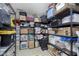 Organized storage room with wire racks, plastic bins, and household items at 15254 Kampen Cir, Carmel, IN 46033